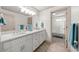 Bright bathroom featuring a double sink vanity, quartz countertop, and access to the shower and toilet at 916 Stratford Rd, Avondale Estates, GA 30002