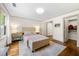 Comfortable bedroom with hardwood floors, stylish decor, and convenient access to a walk-in closet at 916 Stratford Rd, Avondale Estates, GA 30002