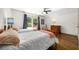 Charming bedroom with twin beds, hardwood floors, and a large window for natural light at 916 Stratford Rd, Avondale Estates, GA 30002