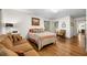 Bedroom with hardwood floors, a plush couch, and natural lighting from the window at 916 Stratford Rd, Avondale Estates, GA 30002