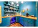 The butler's pantry features custom cabinetry, open shelving, designer wallpaper, and a beverage cooler at 916 Stratford Rd, Avondale Estates, GA 30002