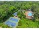 Aerial view of the community pool and tennis courts surrounded by lush greenery at 916 Stratford Rd, Avondale Estates, GA 30002