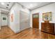 Bright entryway with hardwood floors, beautiful trim, and artwork display at 916 Stratford Rd, Avondale Estates, GA 30002