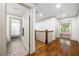Upstairs hallway with hardwood floors, access to bathrooms, and a bedroom with lots of natural light at 916 Stratford Rd, Avondale Estates, GA 30002