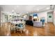 Open-concept living room with hardwood floors, ample lighting, and dining area at 916 Stratford Rd, Avondale Estates, GA 30002