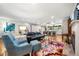Spacious living room with fireplace, modern decor, hardwood floors, and open floor plan at 916 Stratford Rd, Avondale Estates, GA 30002