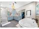 Luxurious main bathroom featuring a soaking tub, walk-in shower, dual sink vanities, and modern fixtures at 916 Stratford Rd, Avondale Estates, GA 30002