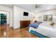 Relaxing main bedroom with hardwood floors and access to the ensuite bathroom and butler's pantry at 916 Stratford Rd, Avondale Estates, GA 30002