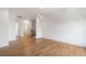 Bright bedroom with hardwood floors and a doorway leading to a bathroom at 002 Wakehurst Way, Marietta, GA 30064