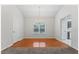 Elegant dining area with hardwood floors, a chandelier, and ample natural light at 10231 Deep Creek Pl, Union City, GA 30291
