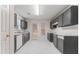 Modern kitchen featuring sleek gray cabinets and stainless steel appliances at 10231 Deep Creek Pl, Union City, GA 30291