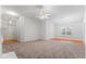 Expansive living room featuring hardwood floors, carpet and large windows at 10231 Deep Creek Pl, Union City, GA 30291