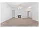 Spacious living room with plush carpeting and a cozy fireplace at 10231 Deep Creek Pl, Union City, GA 30291