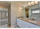 Bathroom featuring granite countertops, a vanity, and a view into an adjacent bedroom at 4421 Fulson Dr, Lilburn, GA 30047