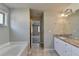 Bathroom features a granite countertop on the vanity and tile flooring at 4421 Fulson Dr, Lilburn, GA 30047