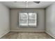 Bedroom featuring neutral walls, ceiling fan, and a window letting in natural light at 4421 Fulson Dr, Lilburn, GA 30047