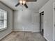 Bedroom with neutral walls, carpet, and door leading to other rooms at 4421 Fulson Dr, Lilburn, GA 30047