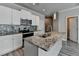 Well-lit kitchen featuring stainless steel appliances, mosaic backsplash, and granite countertops at 4421 Fulson Dr, Lilburn, GA 30047