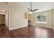 Bedroom featuring hard wood floors, ceiling fan, natural light, and a doorway at 6223 Marbut Farms Ln, Lithonia, GA 30058