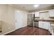 Modern kitchen equipped with stainless steel appliances and granite countertops at 6223 Marbut Farms Ln, Lithonia, GA 30058