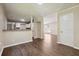 Open-concept living area showcasing seamless flow between kitchen and living spaces at 6223 Marbut Farms Ln, Lithonia, GA 30058