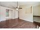 Expansive main bedroom with hardwood floors, ceiling fan, desk nook, and an ensuite bathroom at 6223 Marbut Farms Ln, Lithonia, GA 30058