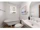 Classic bathroom featuring claw foot tub, updated fixtures, and ample natural light at 653 N Highland Ne Ave # 5, Atlanta, GA 30306