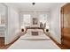 Airy bedroom with hardwood floors, large windows, and neutral decor provides a serene retreat at 653 N Highland Ne Ave # 5, Atlanta, GA 30306