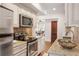 Galley style kitchen with granite counters, stainless steel appliances and hardwood flooring at 653 N Highland Ne Ave # 5, Atlanta, GA 30306