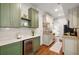 Charming kitchen featuring two-toned cabinets, granite countertops, and an open layout at 653 N Highland Ne Ave # 5, Atlanta, GA 30306