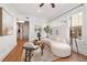 Bright living room with a modern sofa, stylish coffee table, and large windows at 653 N Highland Ne Ave # 5, Atlanta, GA 30306