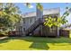 Backyard with deck and stairway access from second story creates a great outdoor space at 7186 Raintree Loop, Jonesboro, GA 30236