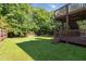 Large backyard with wood fence and mature trees provides plenty of privacy at 7186 Raintree Loop, Jonesboro, GA 30236