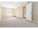 Spacious bedroom offering neutral carpet, ample natural light, and closet space at 7186 Raintree Loop, Jonesboro, GA 30236