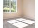 Carpeted bedroom with great natural light and neutral walls is ready for its new occupant at 7186 Raintree Loop, Jonesboro, GA 30236
