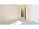Bedroom with closet doors, open doorway and carpet flooring at 7186 Raintree Loop, Jonesboro, GA 30236