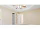 Bedroom with ceiling fan, carpeted floors, and open doorway at 7186 Raintree Loop, Jonesboro, GA 30236
