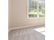 Sunlit bedroom featuring neutral paint, carpet, and large window at 7186 Raintree Loop, Jonesboro, GA 30236