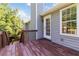 Inviting wooden deck with railing and stairs, perfect for outdoor enjoyment and access to the backyard at 7186 Raintree Loop, Jonesboro, GA 30236