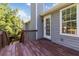 View of the stained wood deck with stairs that lead down to the yard at 7186 Raintree Loop, Jonesboro, GA 30236