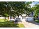 Charming two-story home with gray siding, black shutters, and a well-manicured front yard at 7186 Raintree Loop, Jonesboro, GA 30236