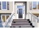 Close-up of the front door, stairway and entrance to a charming well maintained home at 7186 Raintree Loop, Jonesboro, GA 30236