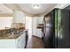 Well-lit kitchen showcasing white cabinets, updated appliances, and modern flooring at 7186 Raintree Loop, Jonesboro, GA 30236