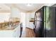 Kitchen featuring white cabinets and modern black appliances at 7186 Raintree Loop, Jonesboro, GA 30236