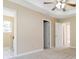 Spacious primary bedroom featuring a trey ceiling, ceiling fan, and doorway leading to a bathroom at 7186 Raintree Loop, Jonesboro, GA 30236