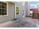 Patio area with access to a wooden deck and the home's exterior at 7186 Raintree Loop, Jonesboro, GA 30236