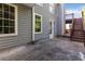 Backyard patio with direct home access and stair access to the backyard deck at 7186 Raintree Loop, Jonesboro, GA 30236