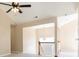 Upstairs hallway featuring a staircase with white railings and a window letting in natural light at 7186 Raintree Loop, Jonesboro, GA 30236