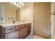 Bathroom showcasing vanity with drawers and cabinets, with a large mirror at 308 Rusty Gate Pass, Woodstock, GA 30189