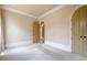 Neutral bedroom featuring neutral carpet floors, archway door, and trim work at 308 Rusty Gate Pass, Woodstock, GA 30189